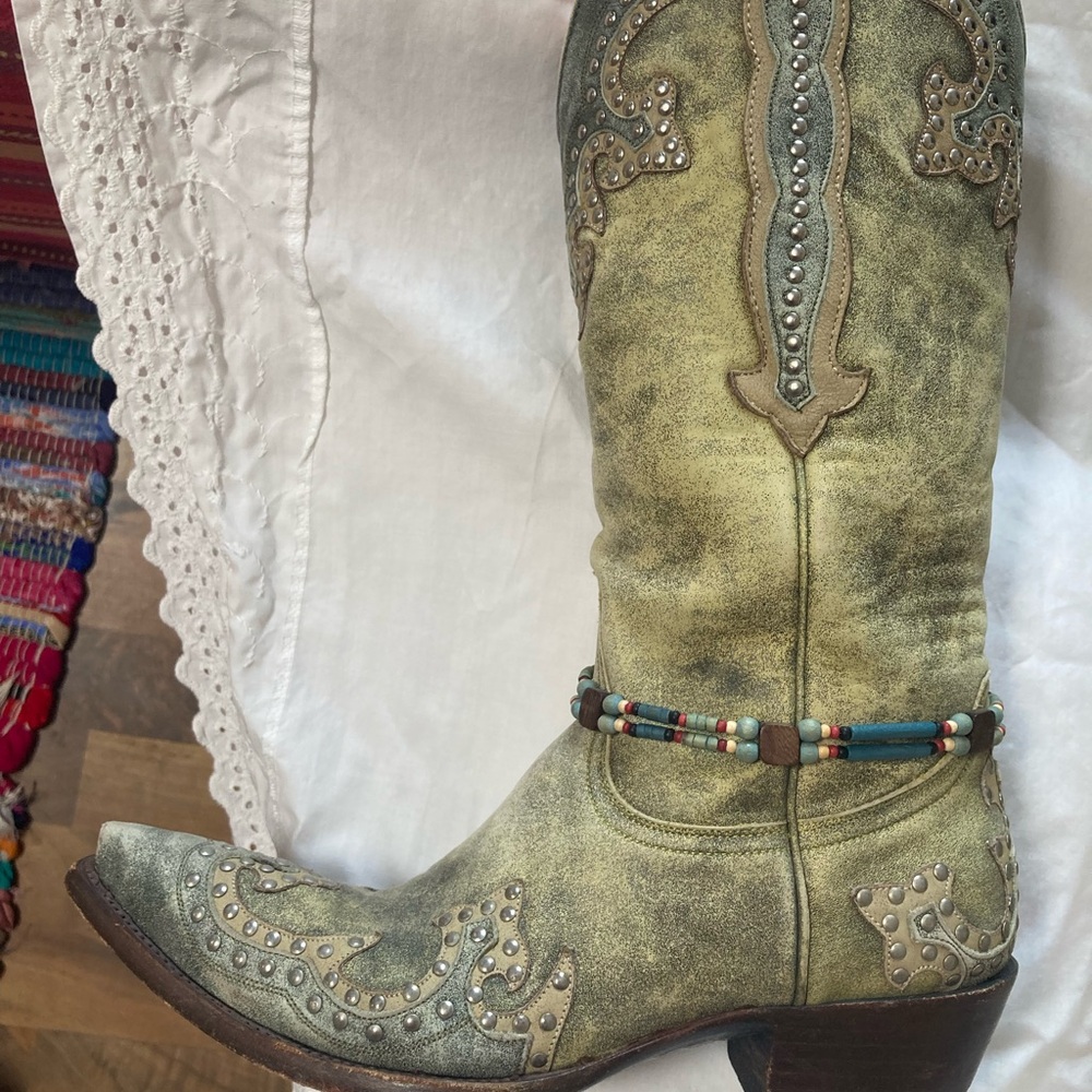 Old gringo, distressed green with studs. 14”